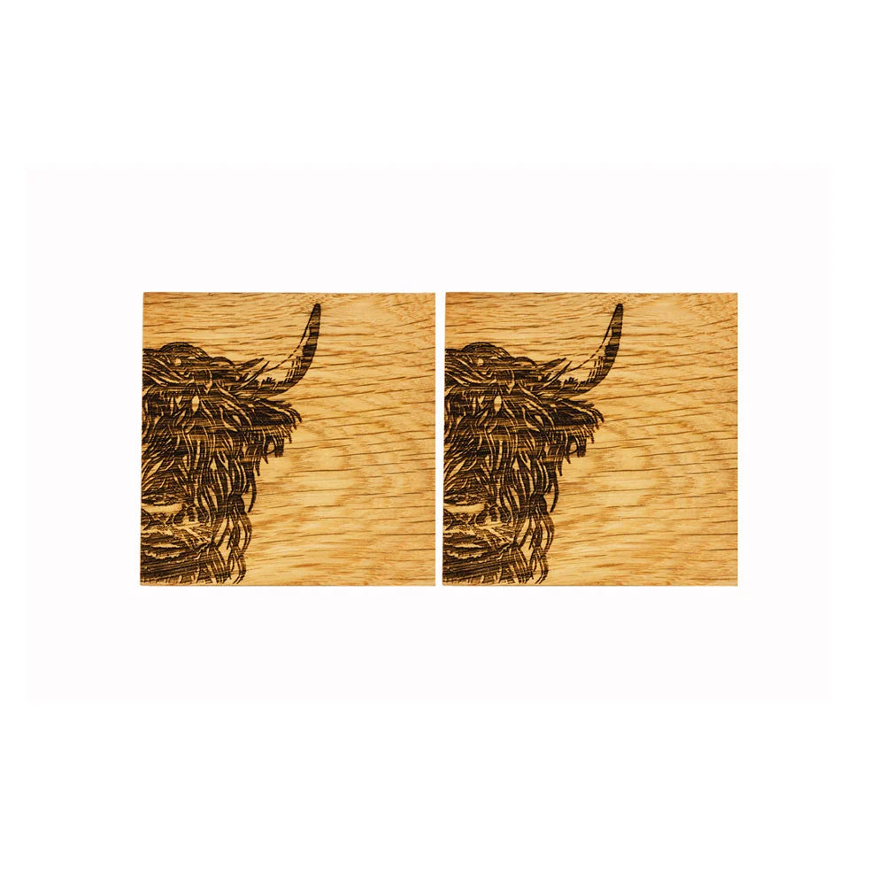 Two wooden panels with engraved bull heads on a white background