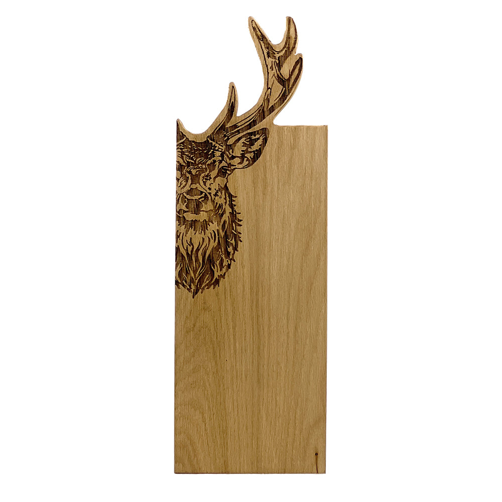 Wooden cutting board with laser-cut deer head design on a white background