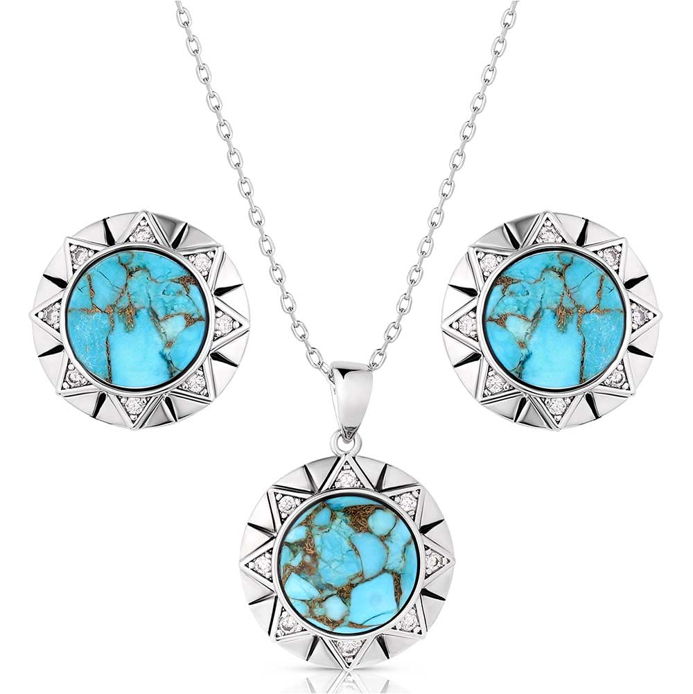 Montana Silversmiths Inner Love Turquoise Jewelry Set. A matching jewelry set with a necklace and earrings featuring a central turquoise stone, with silver-tone borders and clear cubic zirconia crystals.