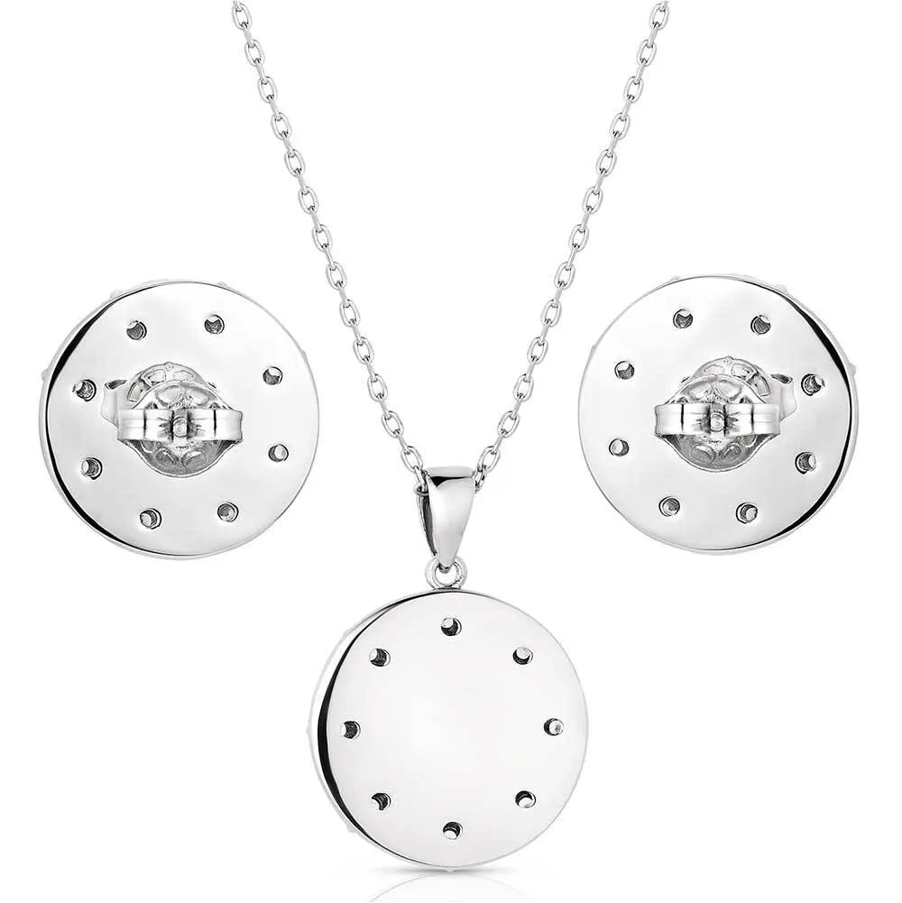 Montana Silversmiths Inner Love Turquoise Jewelry Set. Silver jewelry set with circular pendant and earrings on white background