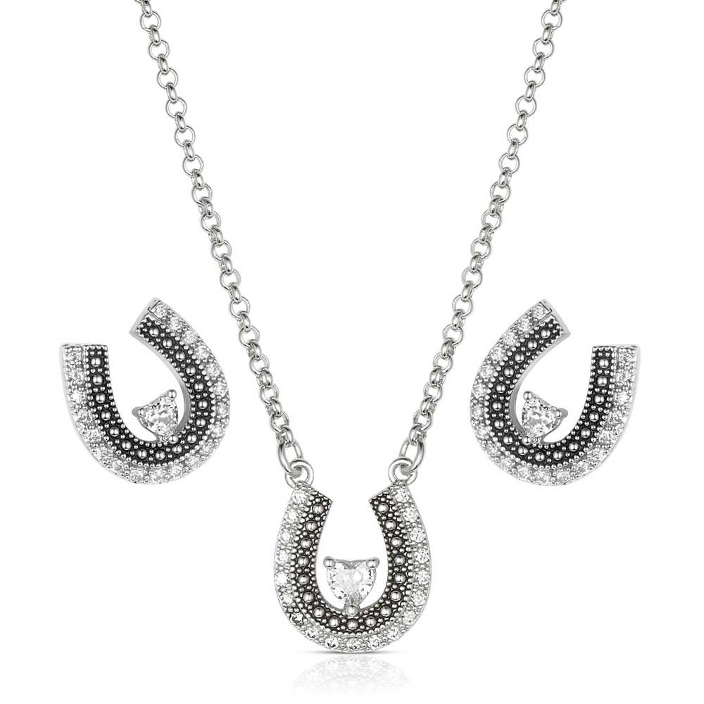 Montana Silversmith the Lovely and Lucky Horseshoe Jewelry Set features a beautifully detailed horseshoe pendant on a split chain, adorned with cubic zirconia crystals that encircle the shoe and a beaded edge with black antiquing along the inside.