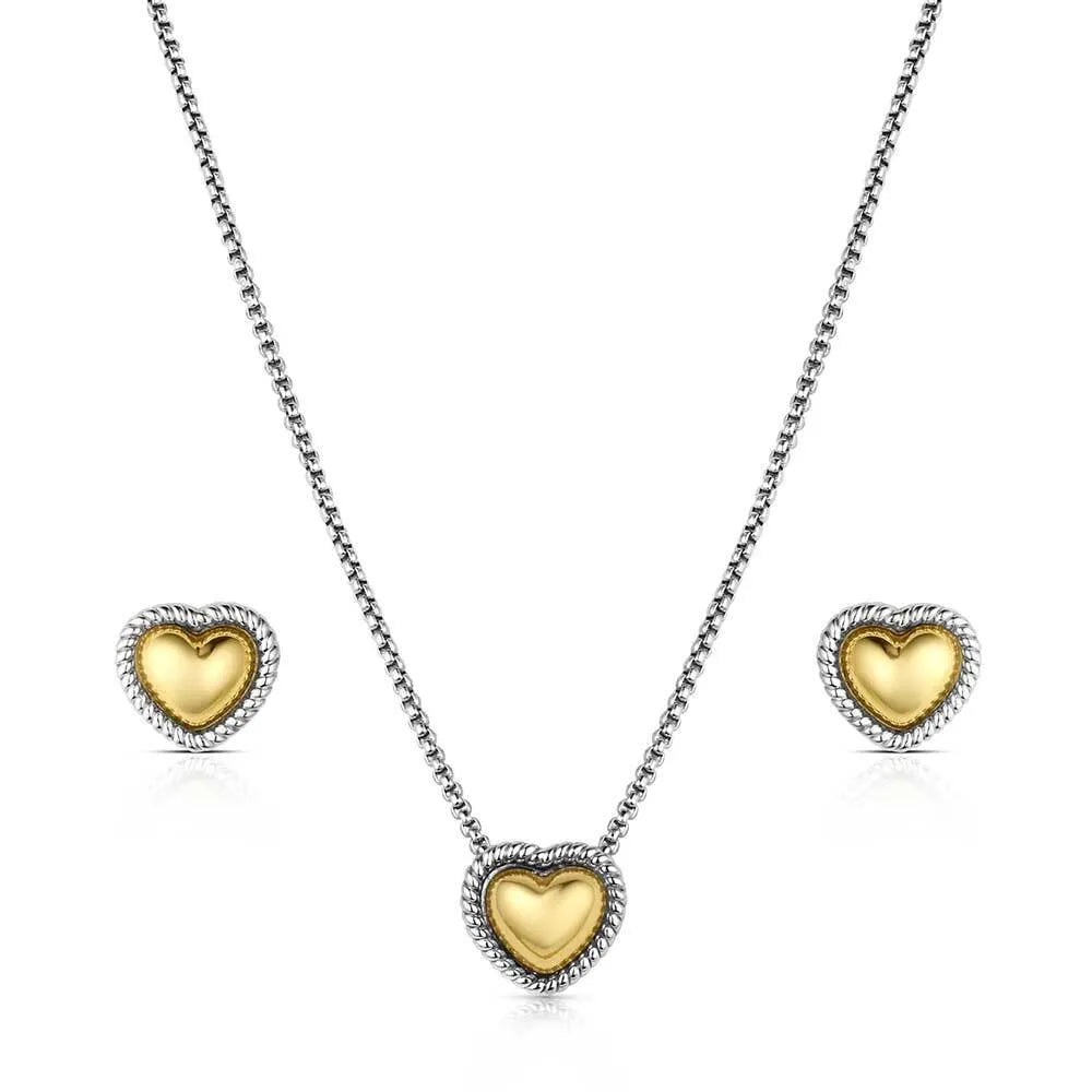Gold heart-shaped jewelry set with necklace and earrings on a white background