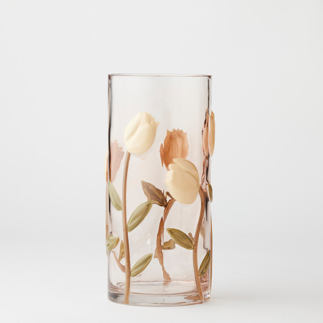 Clear glass vase with floral design on a white background