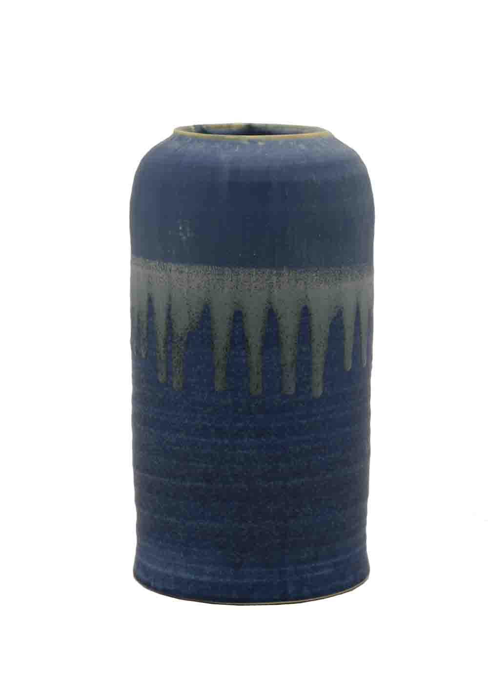 Blue ceramic vase with a textured surface on a white background