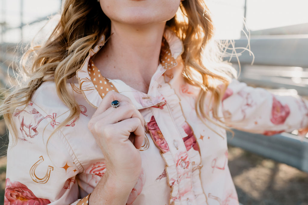 Woman wearing a floral blouse with a blurred background