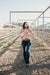 Kitty Fordè Margie Printed L/S Shirt. Woman wearing a colorful floral blouse outdoors