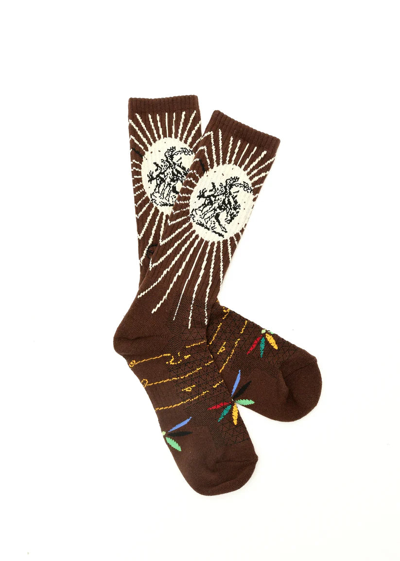 Lucky Chuck Fringe Bucking Western Cowgirl Performance Socks. Brown socks with white abstract design on a white background