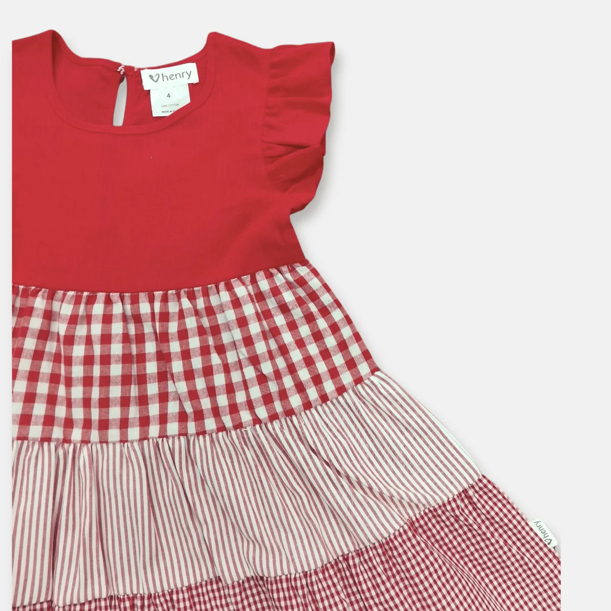 Love Henry Girl's Ivy Dress. A girl's red dress with red and ivory checkered and gingham patterns, designed with a round neckline and short sleeves.