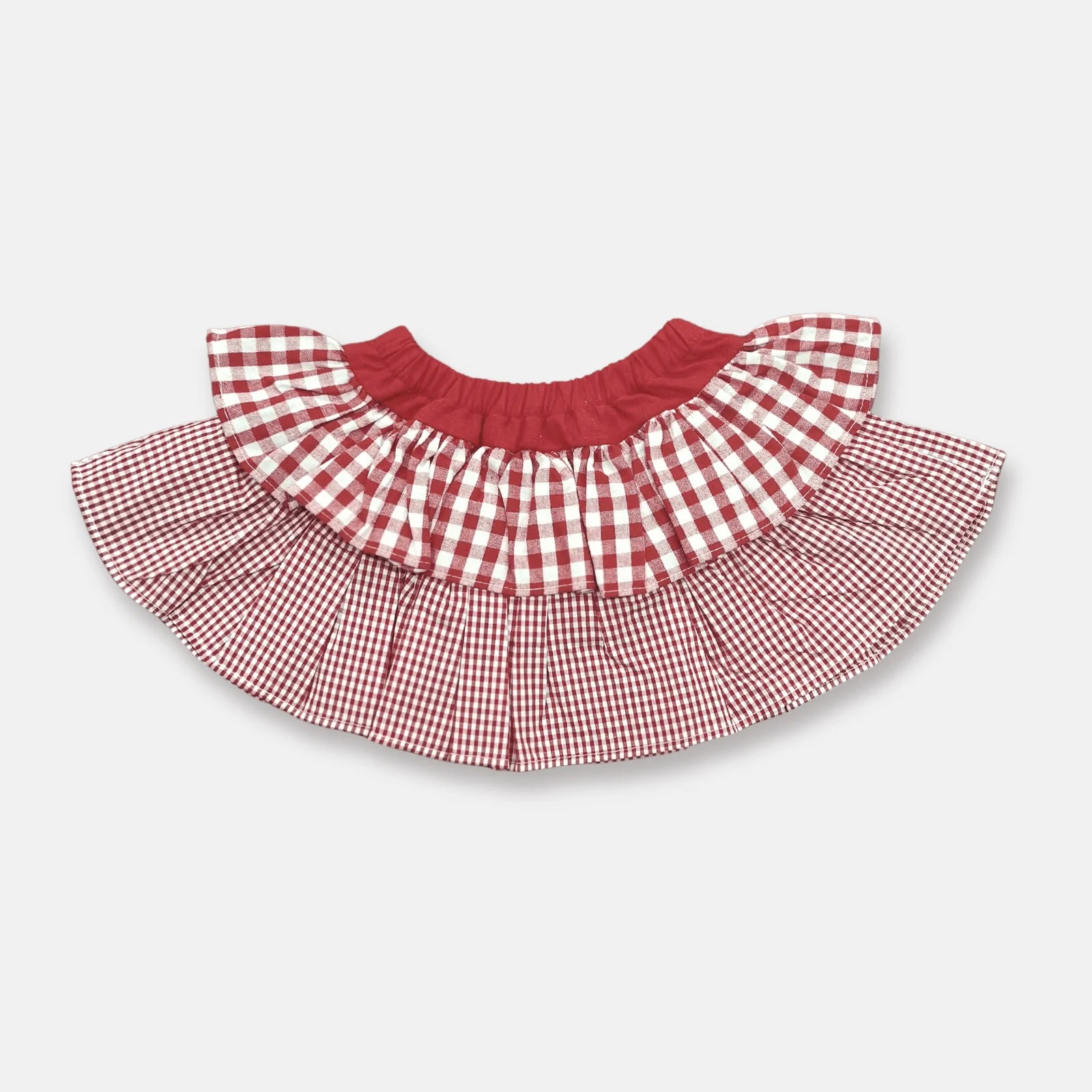 Love Henry Girl's Frilly Skirt. A girl's frilly skirt with a red and white checkered pattern and a solid red color at the bottom, featuring an elasticated waistband.