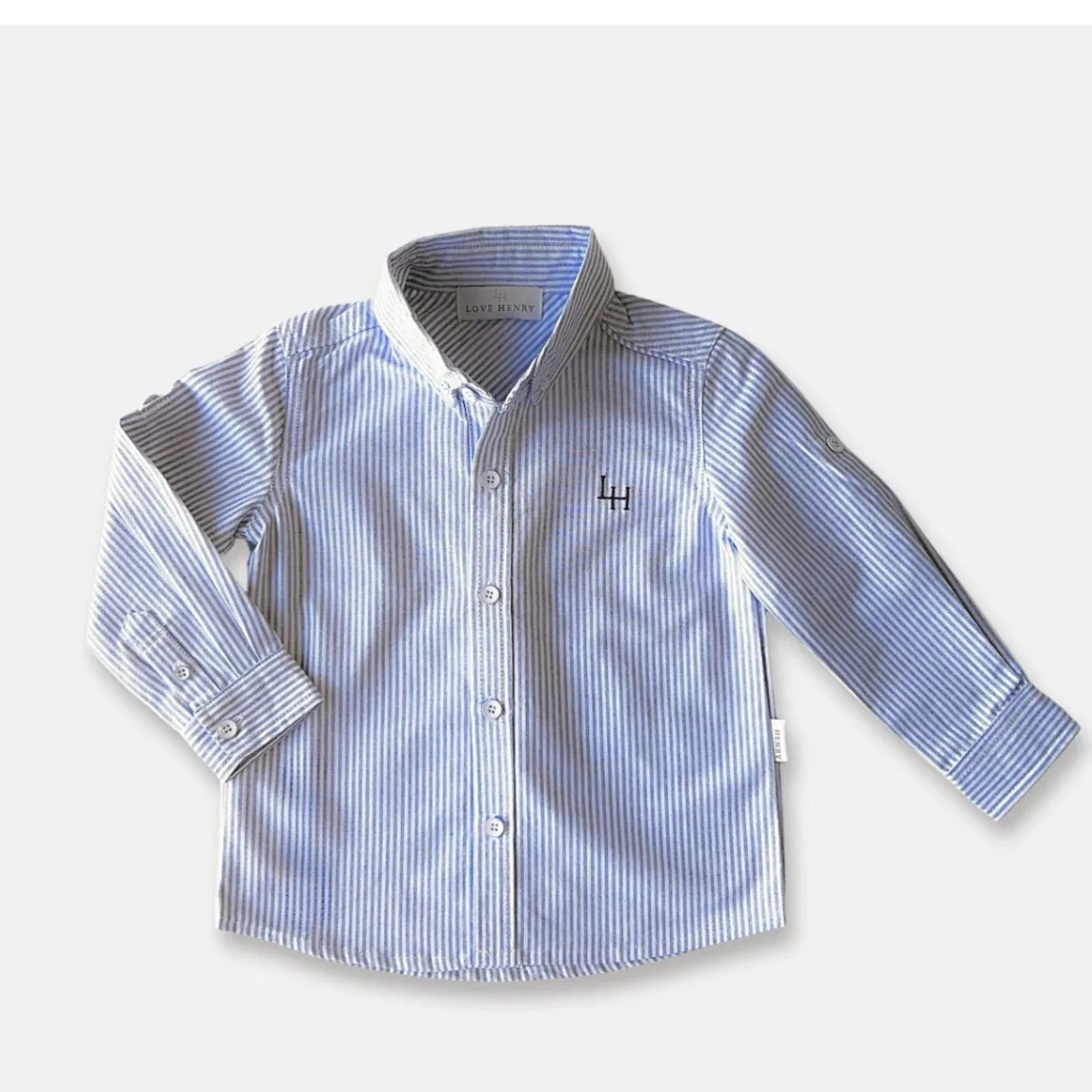 Love Henry Boy's Oxford Dress Shirt. Blue and white striped shirt on a light gray background