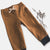 Love Henry Baby Boy's Comfy Pants. Brown children's pants with a bow on a light gray background