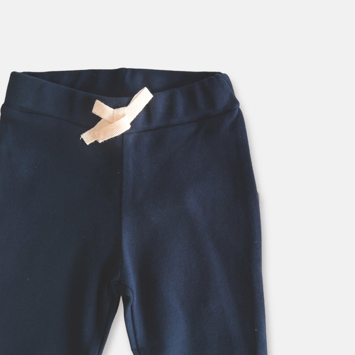 Love Henry Baby Boy's Comfy Pants. Navy blue pants with a beige label on a white background