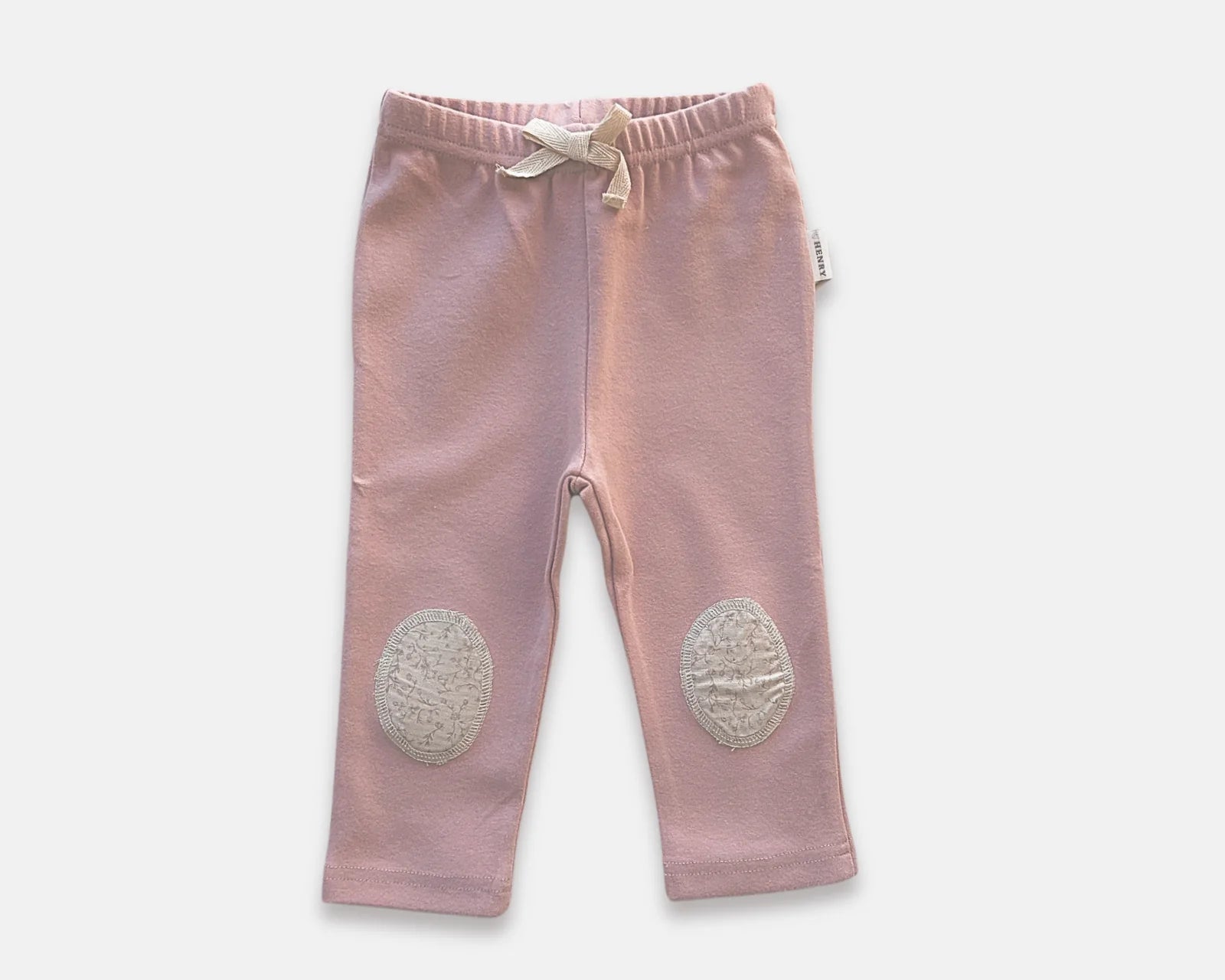 Love Henry Baby Girl's Comfy Pants. A pair of pink baby girl's comfy pants with patches on the knees.