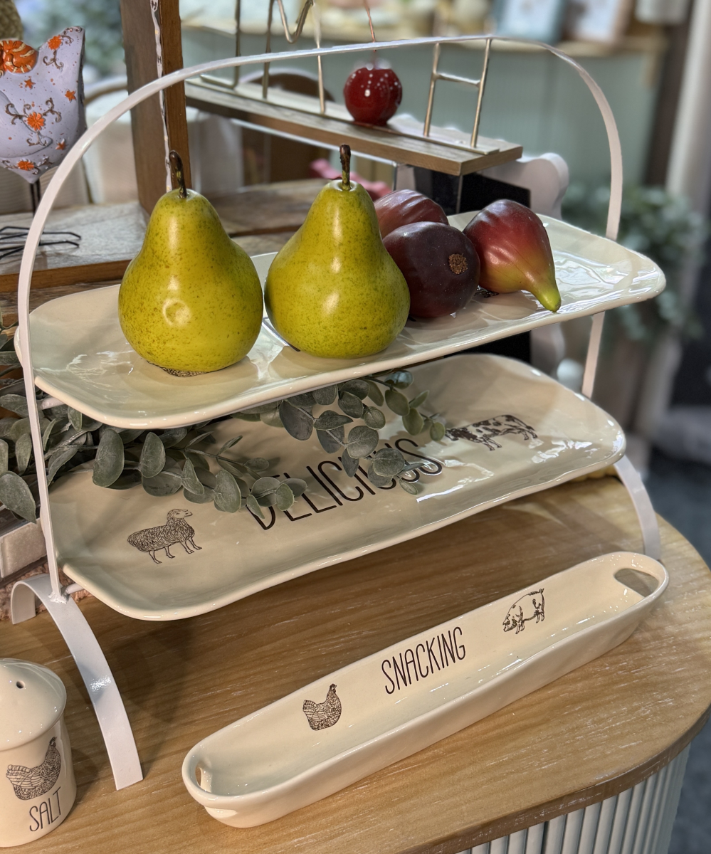 Farm Design Set of 2 Plates with Stand. Three-tiered ceramic tray with pears, figs, and decorative elements on a wooden surface.