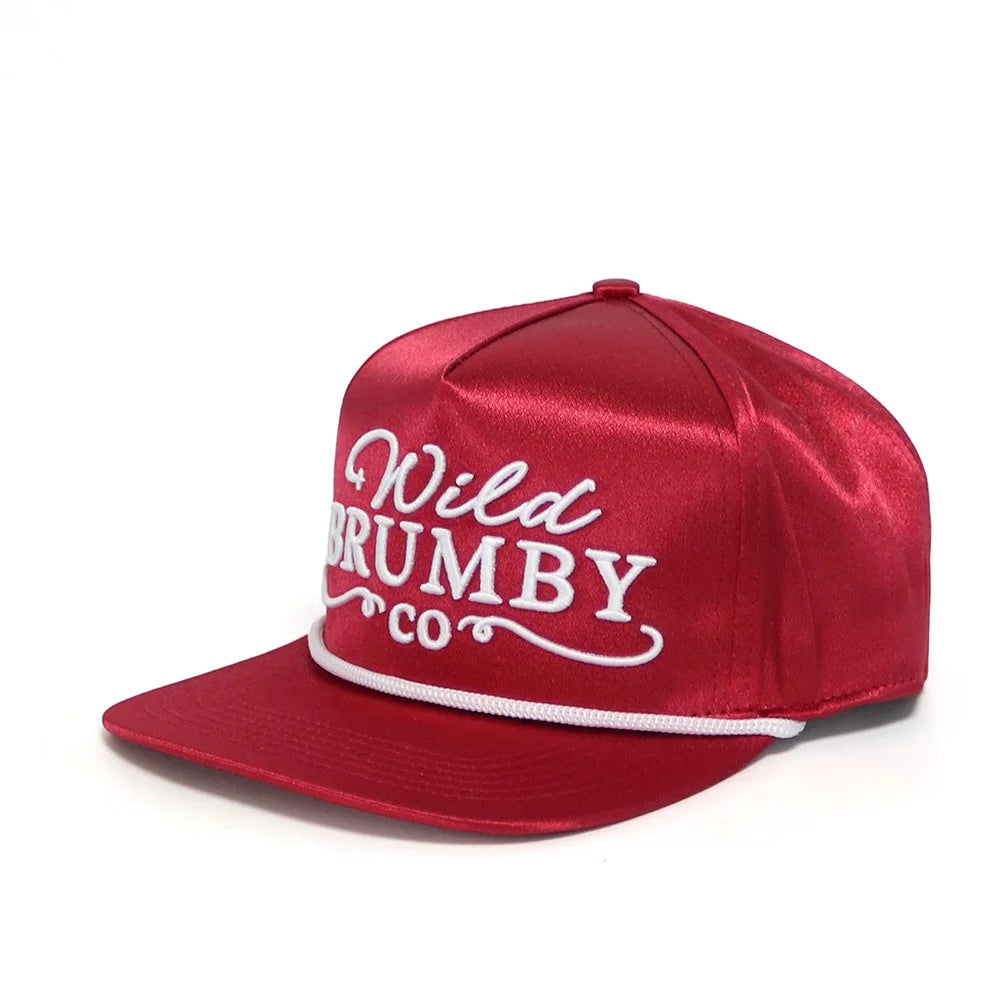 Red satin cap with 'Wild Brumby Co' text on a white background