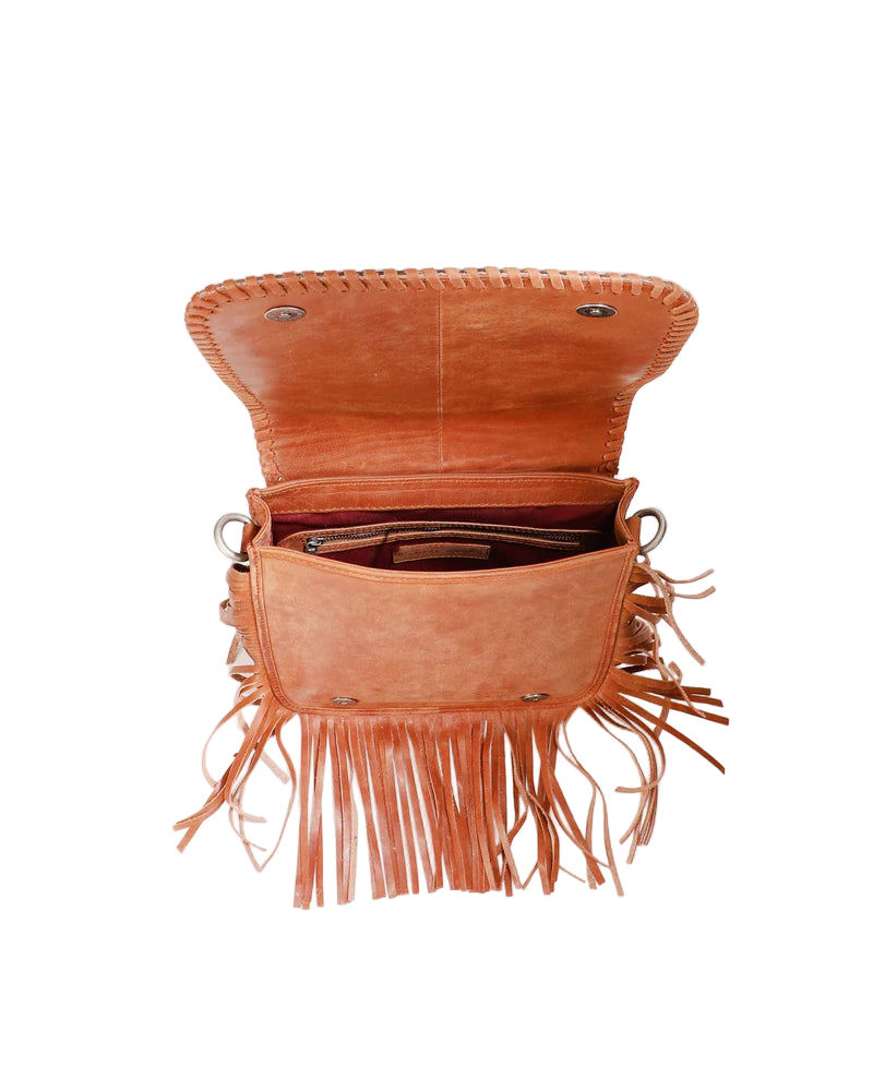 Loyal West Luciana Western Tassle Bag. Brown leather bag with fringe on a light beige background
