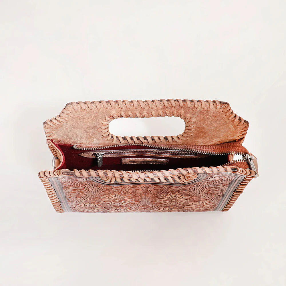 Loyal West Alma Medium Western Handbag. Brown leather clutch with intricate patterns on a white background
