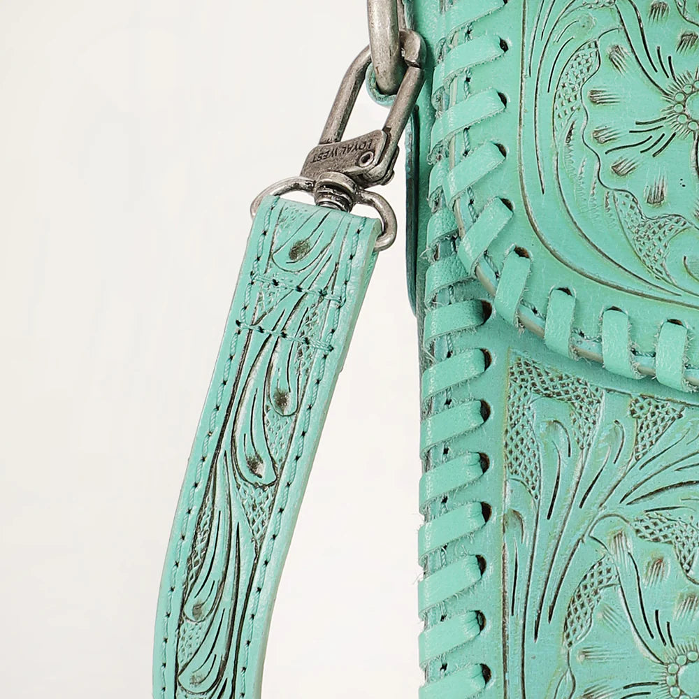 Loyal West Daisy Mini Western Bag. Turquoise leather bag with intricate patterns and a strap on a light beige background