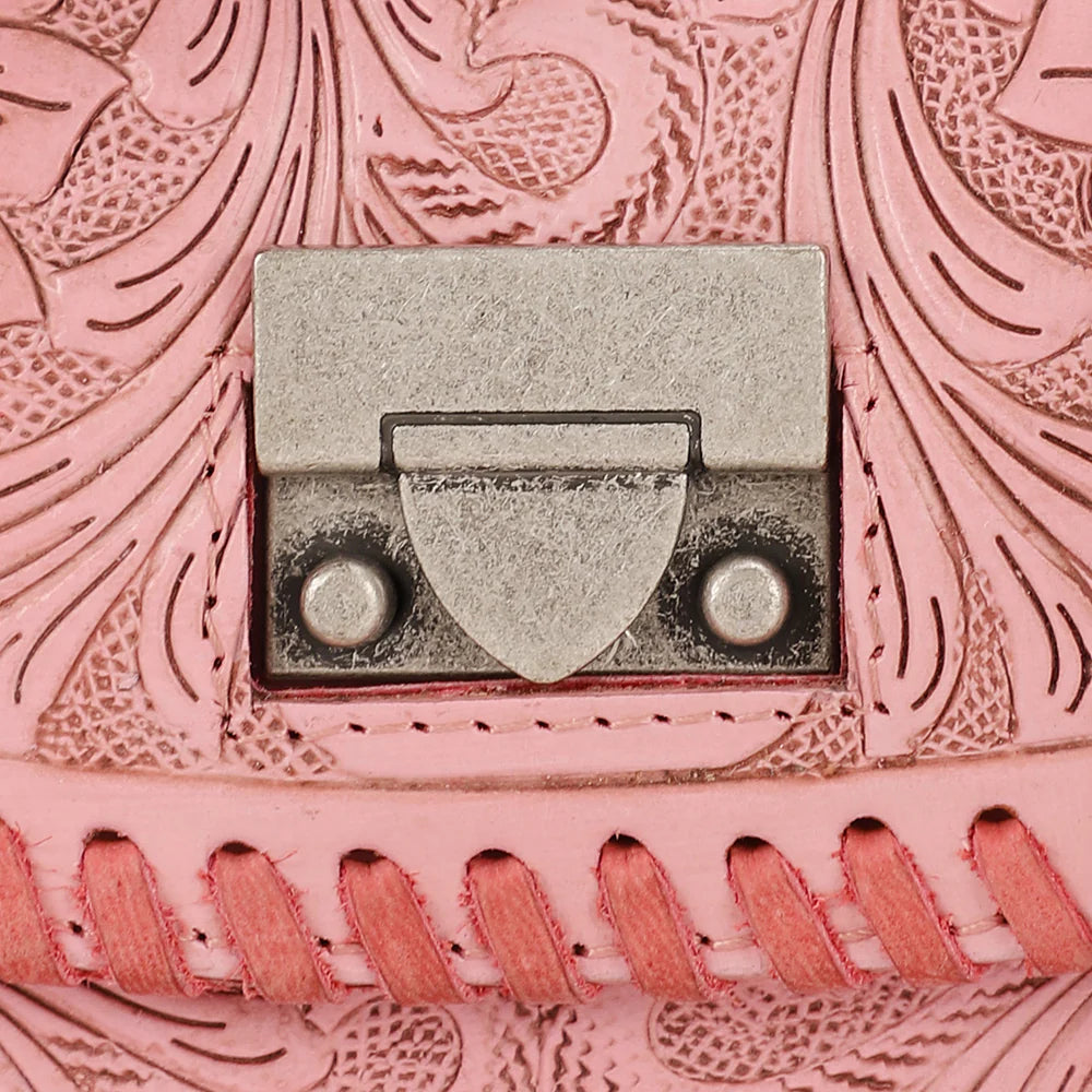 Loyal West Elena Mini Western Bag. Close-up of a pink leather product with intricate patterns and a metal buckle.