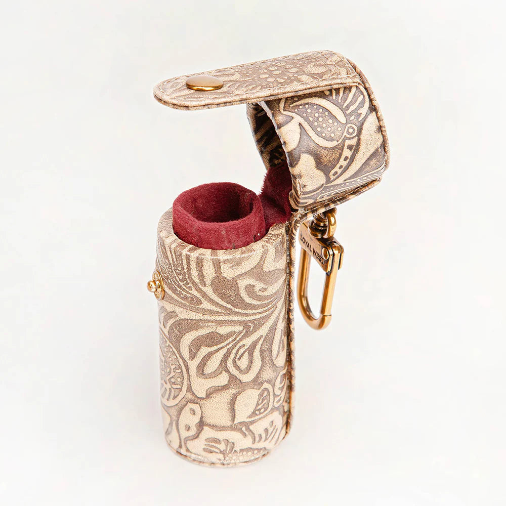 Decorative lighter with intricate patterns on a white background