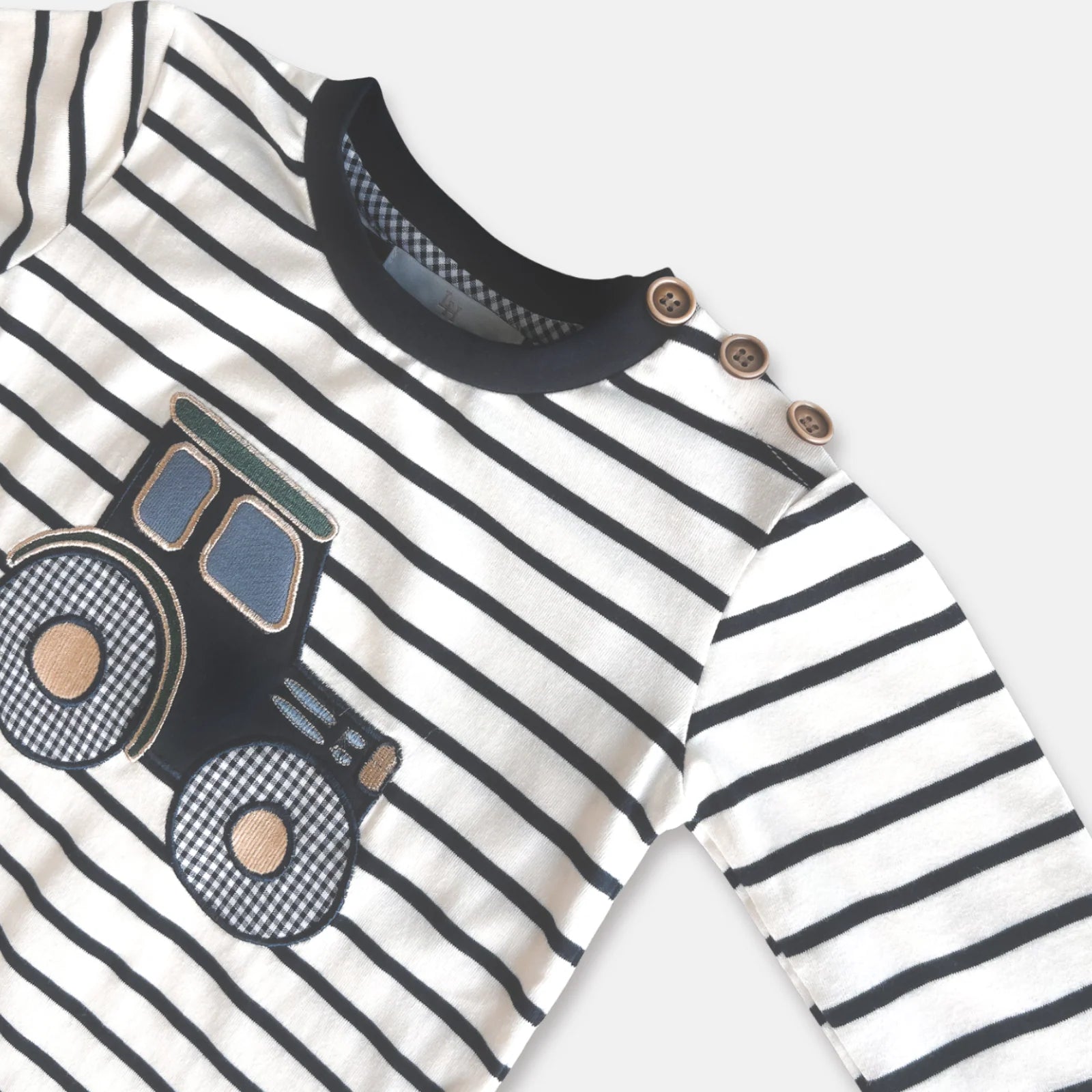 Love Henry Baby Boy's Applique L/S Tee. Striped long-sleeve shirt with a truck design on a light gray background