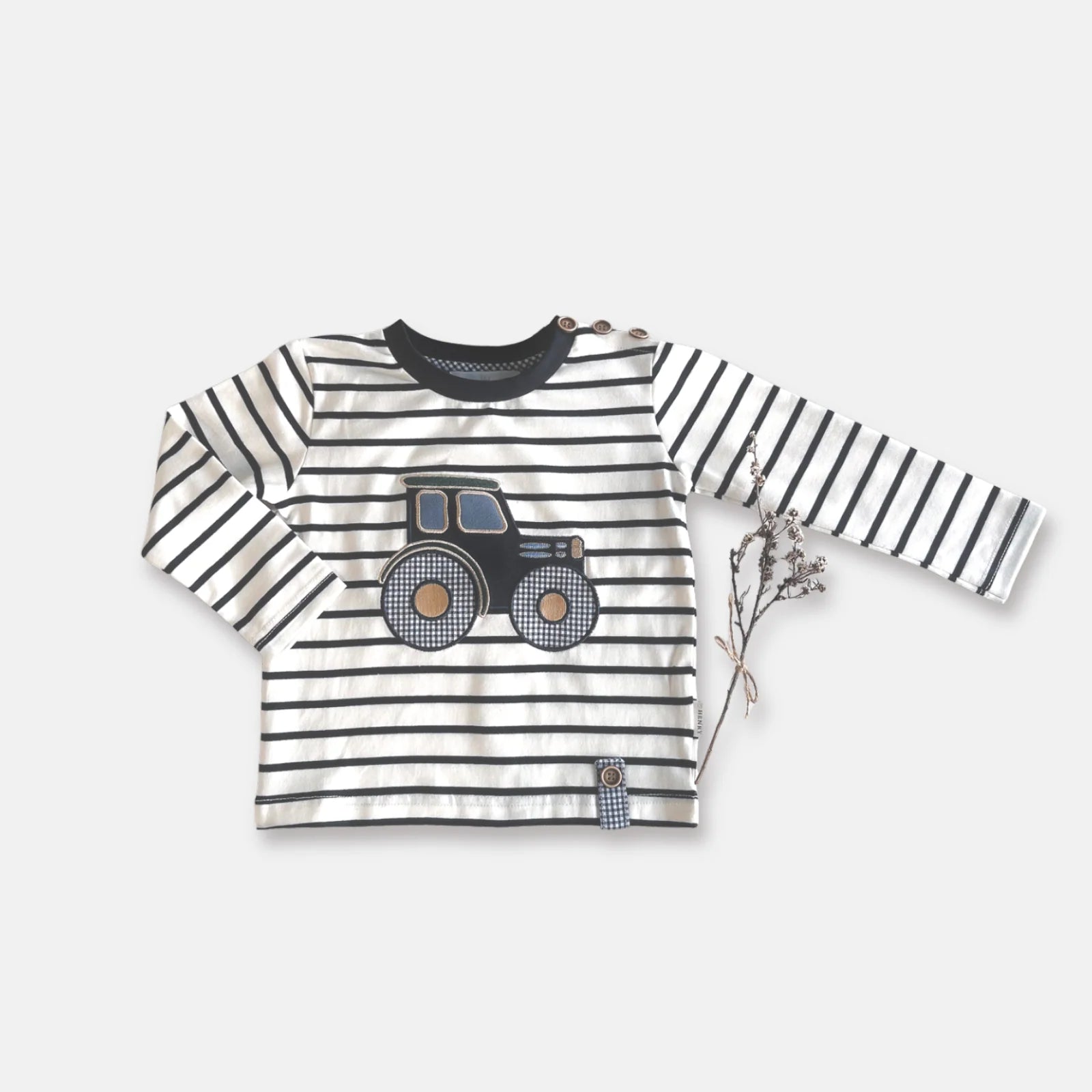 Love Henry Baby Boy's Applique L/S Tee. Striped long-sleeve shirt with a truck design on a light gray background