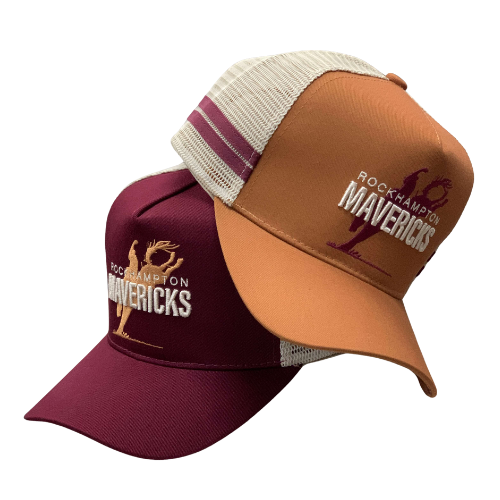 Rocky Mavericks Trucker Cap. Two trucker caps, one in red and one in brown, with 'ROCKY MAVERICKS' text on them.