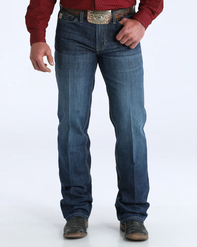 Person wearing blue jeans and a red shirt on a white background
