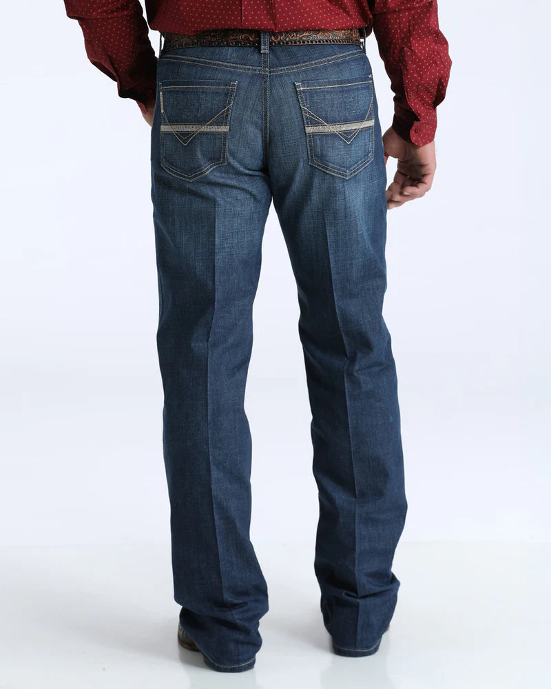 Person wearing blue jeans on a white background