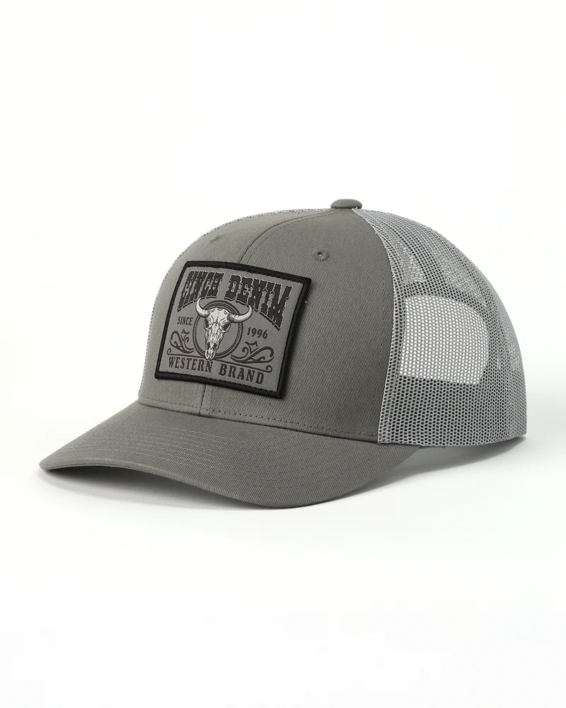 Cinch Men's Mid-Profile Trucker Cap. Gray trucker hat with a leather patch on a white background