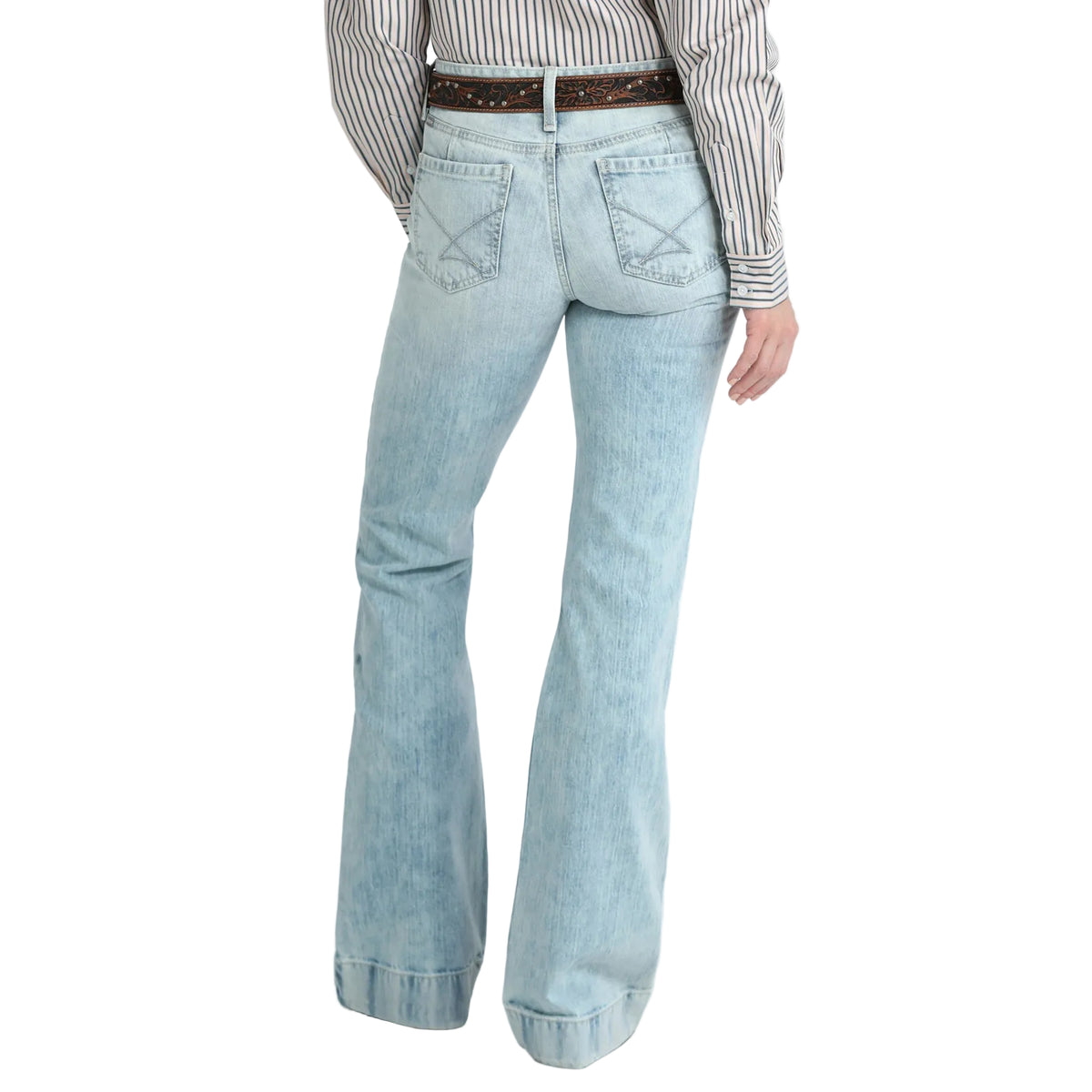 Light blue flared jeans worn with a striped shirt on a white background