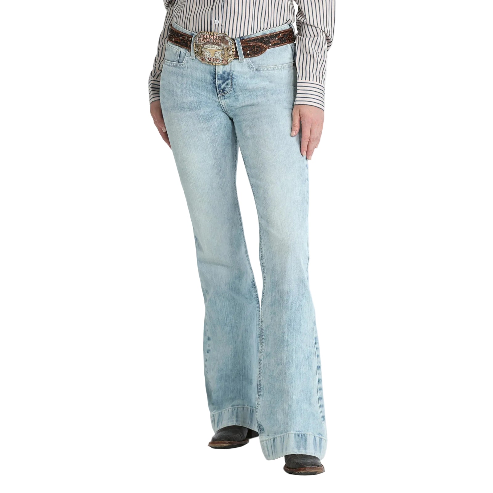Light blue flared jeans worn by a person on a white background