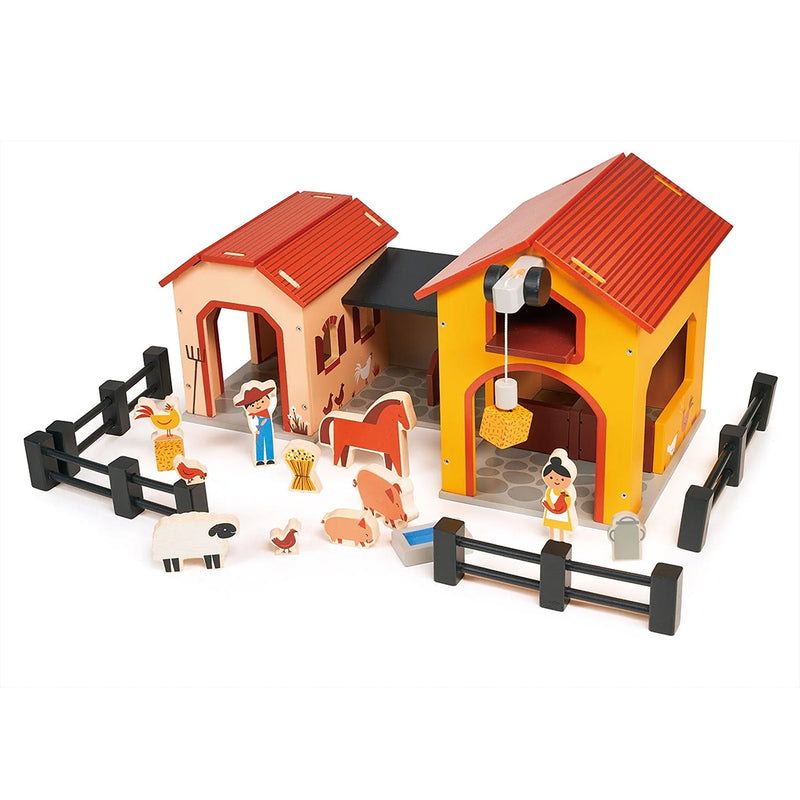 Kaleidoscope Billy's Barnyard. Toy farm set with barns, animals, and figures on a white background