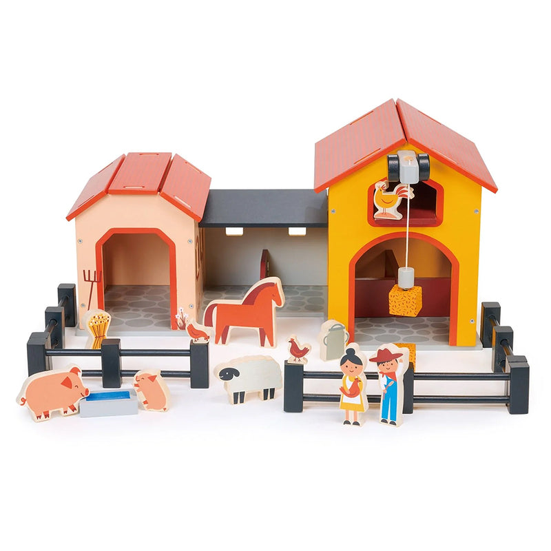 Kaleidoscope Billy's Barnyard. Toy farm set with barn, animals, and figures on a white background