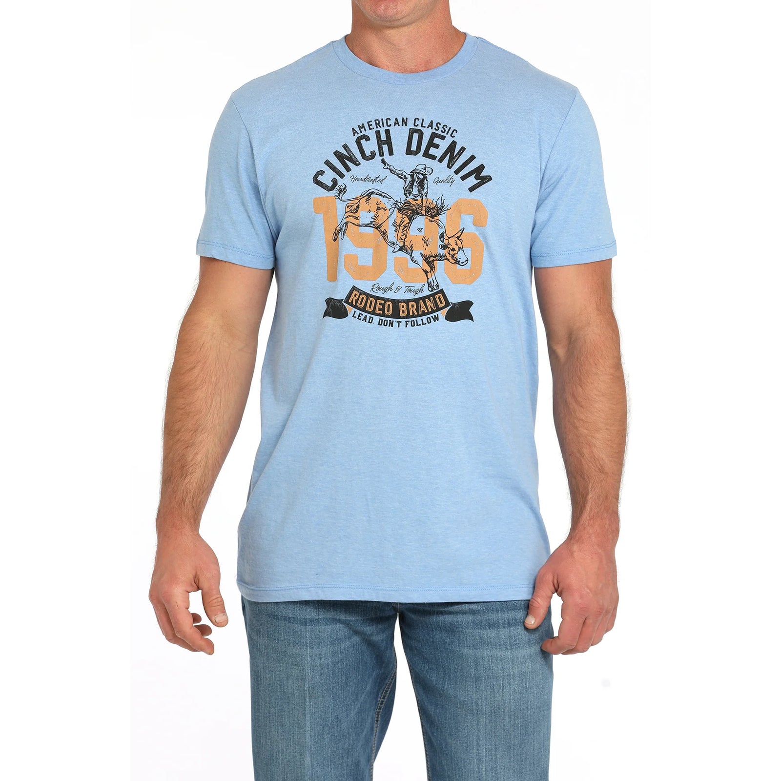Cinch Men's Western Graphic T-Shirt. Man wearing a light blue t-shirt with graphic design and text on a white background