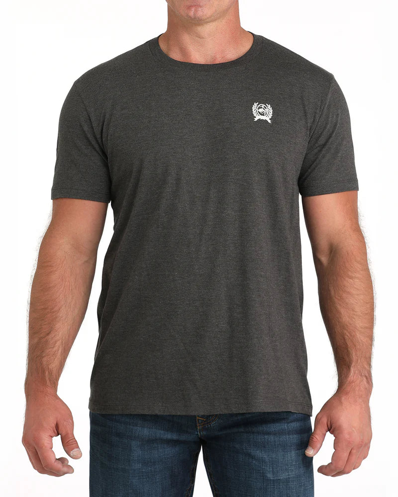 Cinch Men's Graphic T-Shirt. Person wearing a dark gray t-shirt with 'Cinch' logo on the back, on a white background