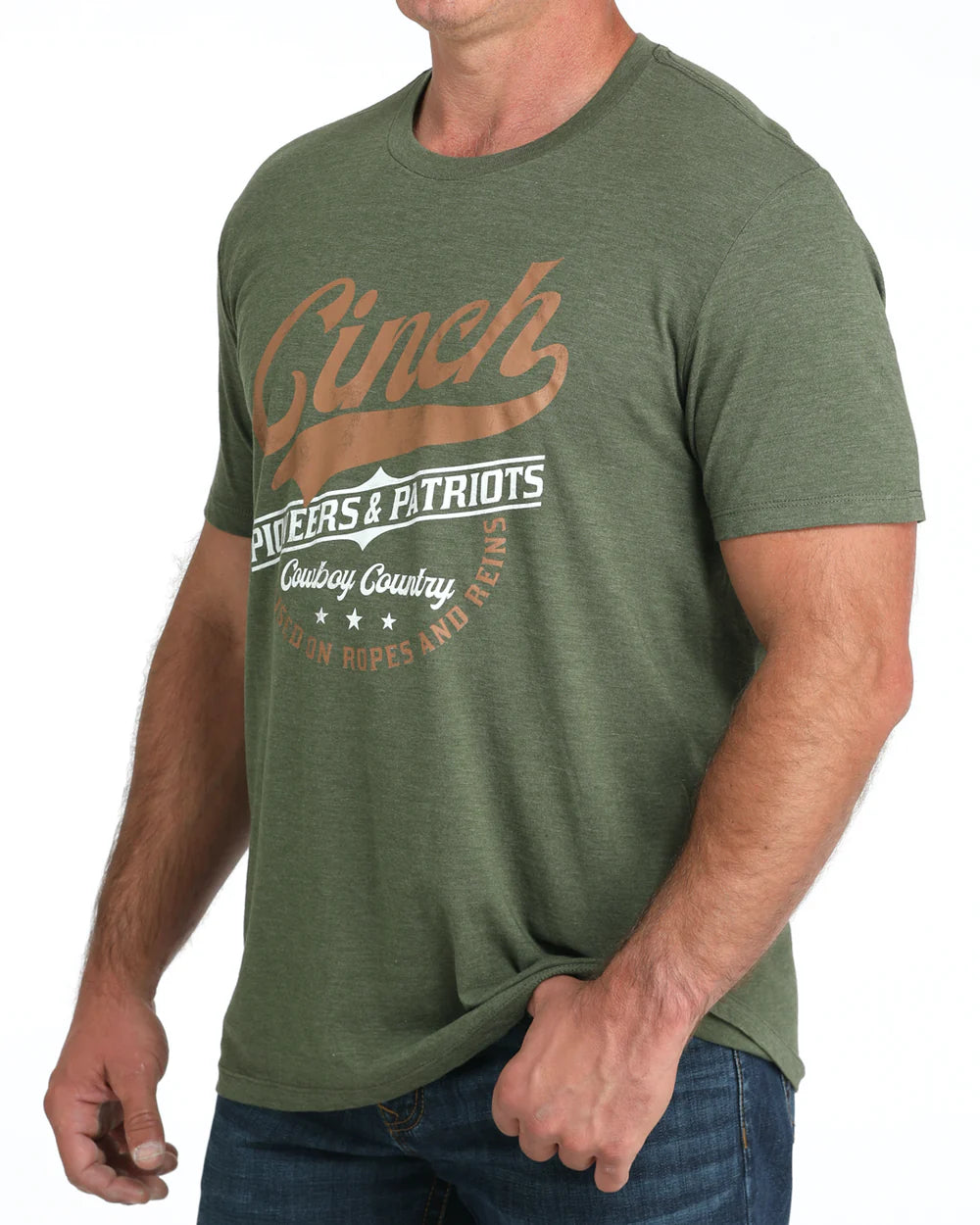 Cinch Men's Graphic Tee. Green t-shirt with 'Cinch' branding worn by a person on a white background