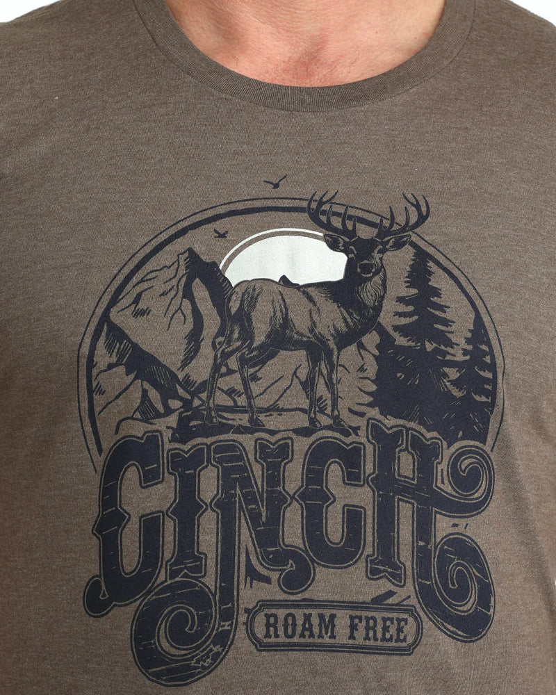 Brown t-shirt with a deer graphic and 'Ginch' branding on a plain background