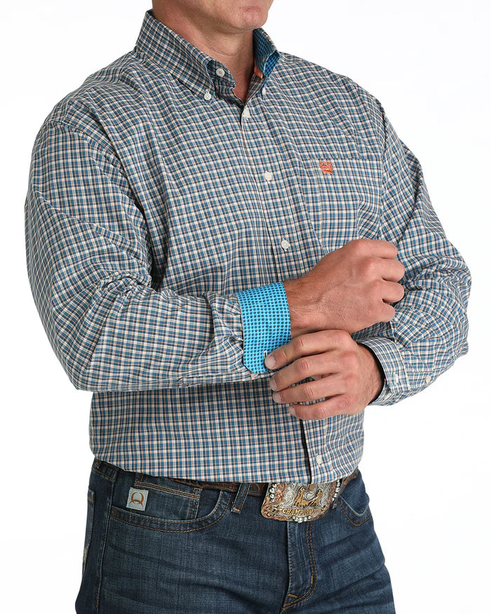 Cinch Men's Classic Fit Check L/S Western Shirt. Person wearing a plaid shirt with a visible brand logo on a white background