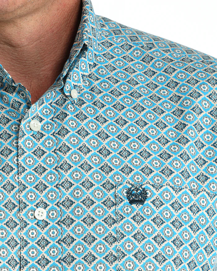 Cinch Men's Classic Fit Geometric Print L/S Western Shirt. Close-up of a patterned shirt with a visible brand logo.