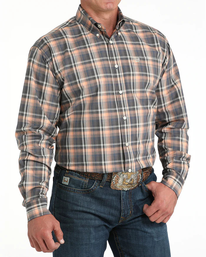 Cinch Men's Classic Fit Check L/S Western Shirt. Man wearing a plaid shirt and jeans with a belt buckle on a white background