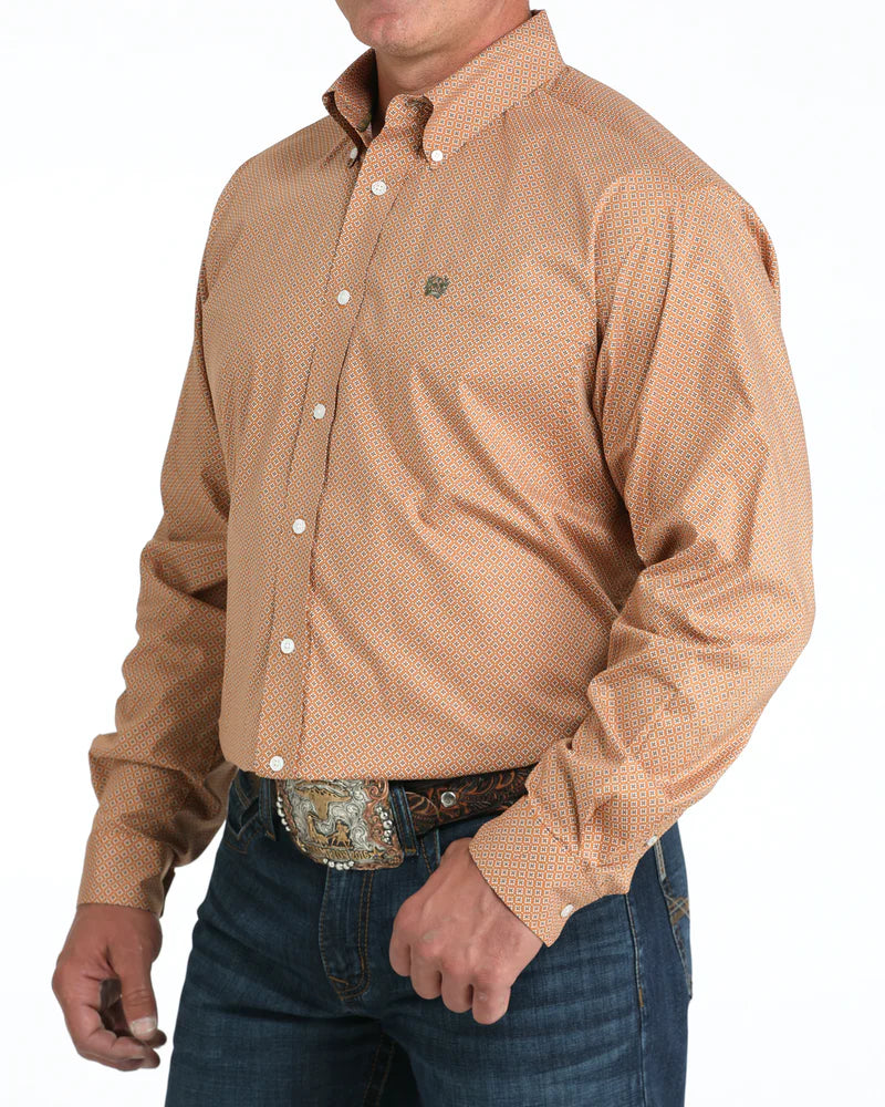Cinch Men's Stretch Classic Fit Button-Down Western Shirt. Man wearing a beige patterned shirt and blue jeans on a white background