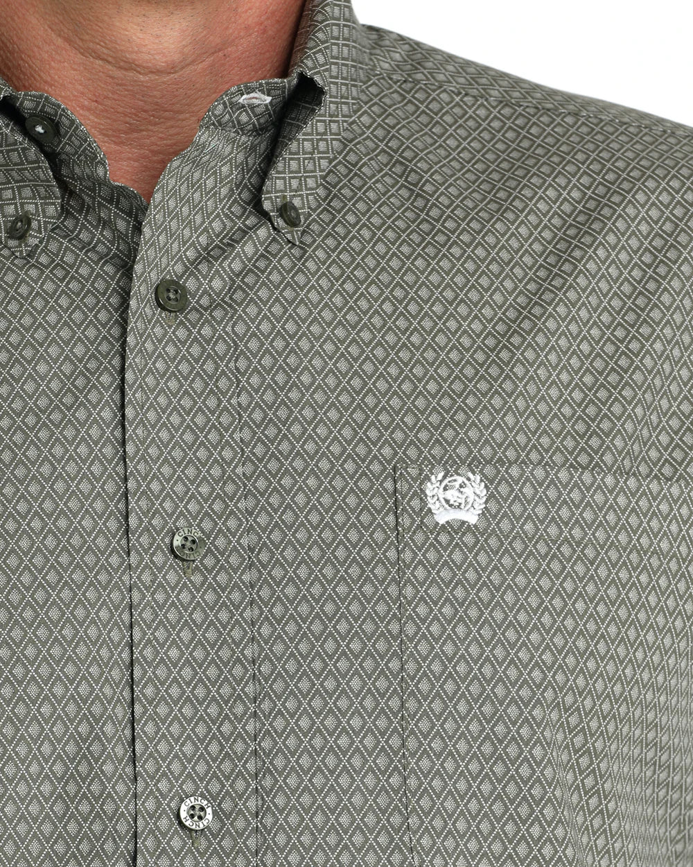 Cinch Men's Classic Fit Button-Down Western Shirt. Close-up of a patterned shirt with a brand logo on a white background