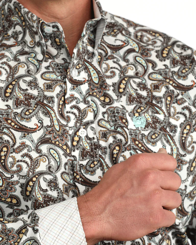 Close-up of a person wearing a patterned shirt with a focus on the fabric texture.