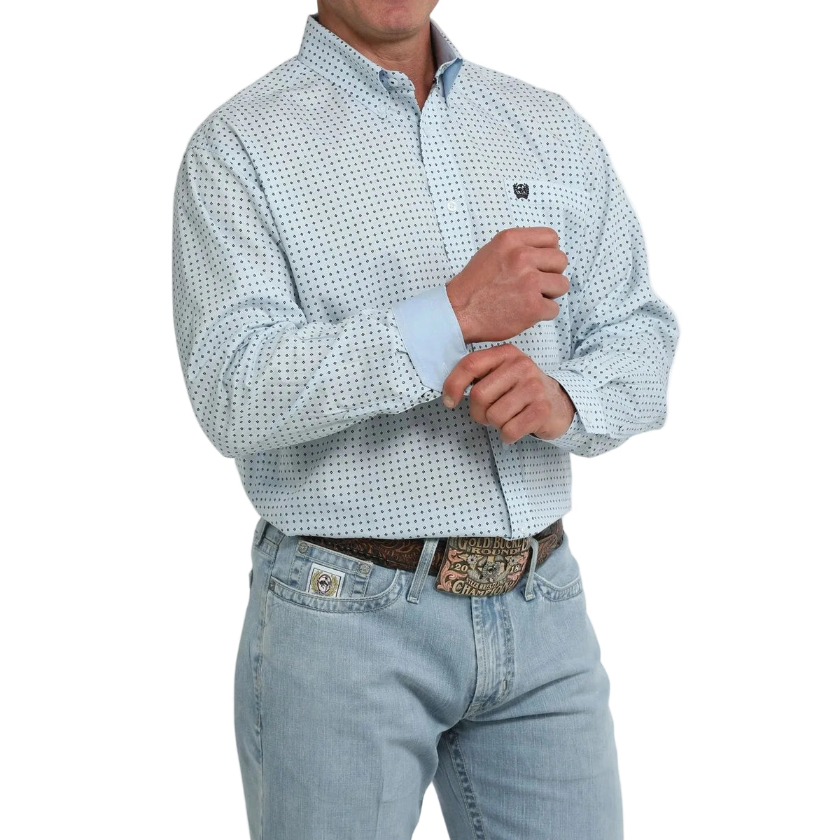 A man wearing a light blue and white micro-patterned long-sleeve western shirt with light blue jeans and a western belt, shown from the chin down on a white background.