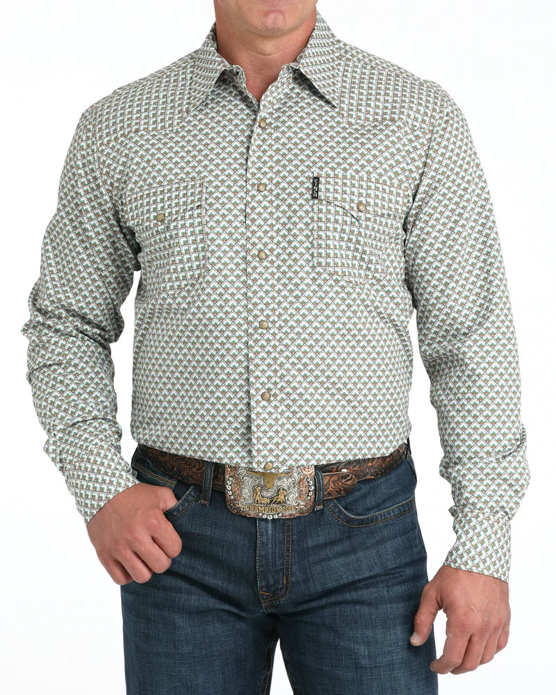 Cinch Men's Modern Fit Snap Front Western Shirt. Man wearing a patterned shirt and jeans on a white background