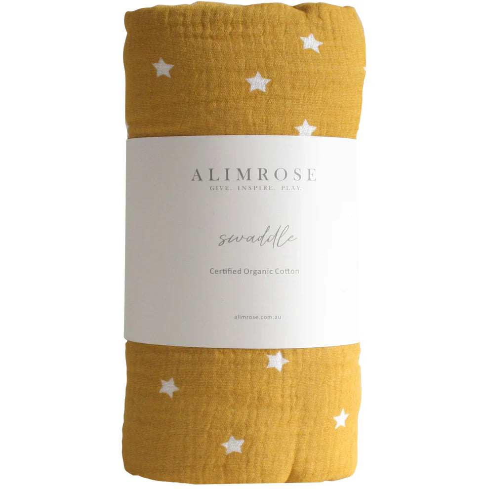 Alimrose Muslin Swaddle Starry Night Butterscotch. Yellow swaddle blanket with white stars and 'Alimrose' branding on a white background