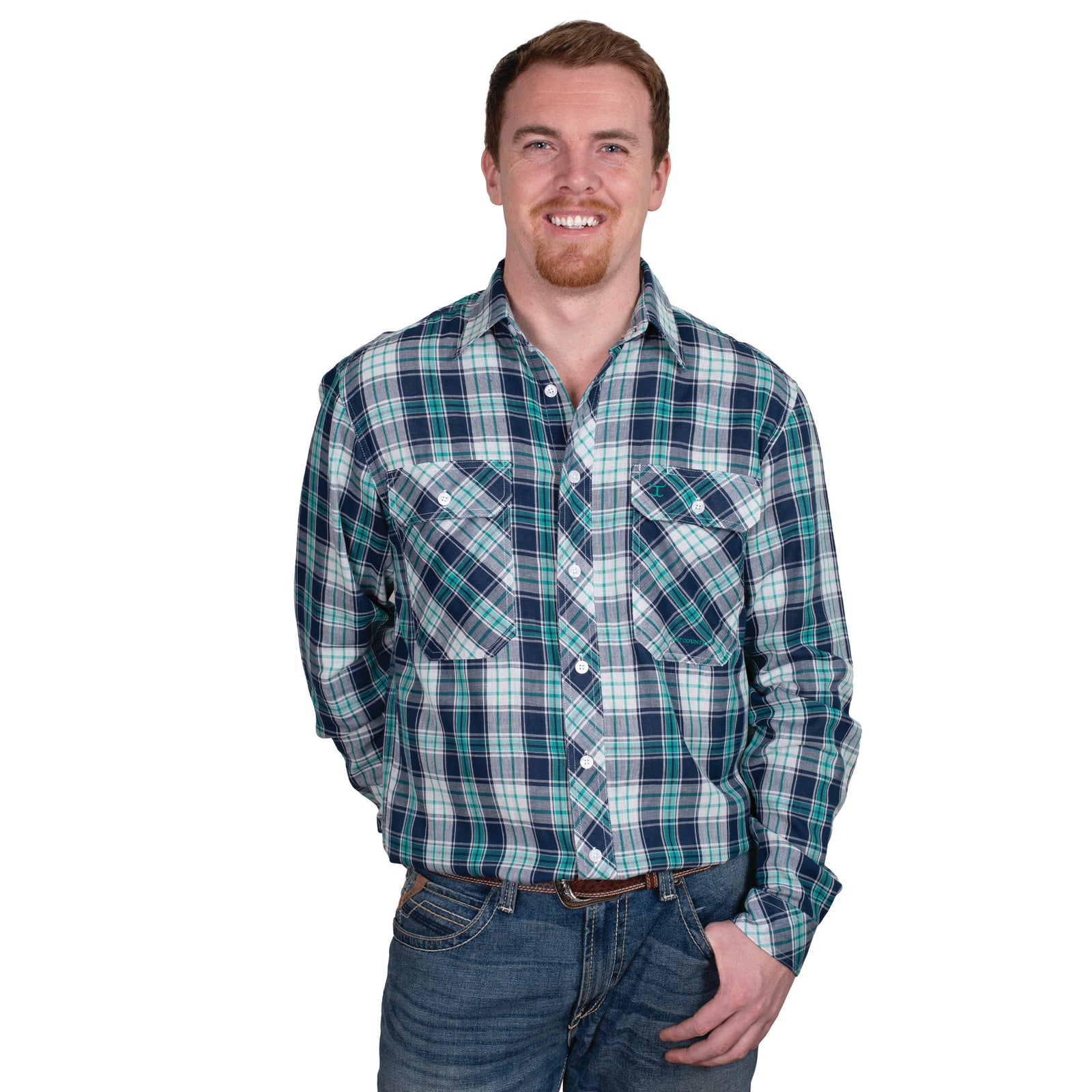 Just Country Men's Austin L/S Print Workshirt. A man wearing a long-sleeved, checkered, blue and green workshirt and jeans.