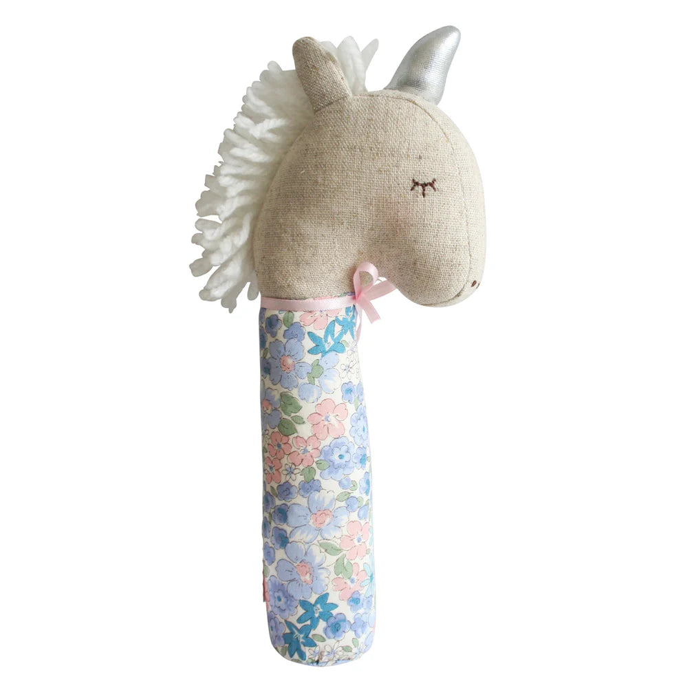 Alimrose Yvette Unicorn Squeaker Liberty Blue. Unicorn-shaped rattle with floral patterned handle on a white background