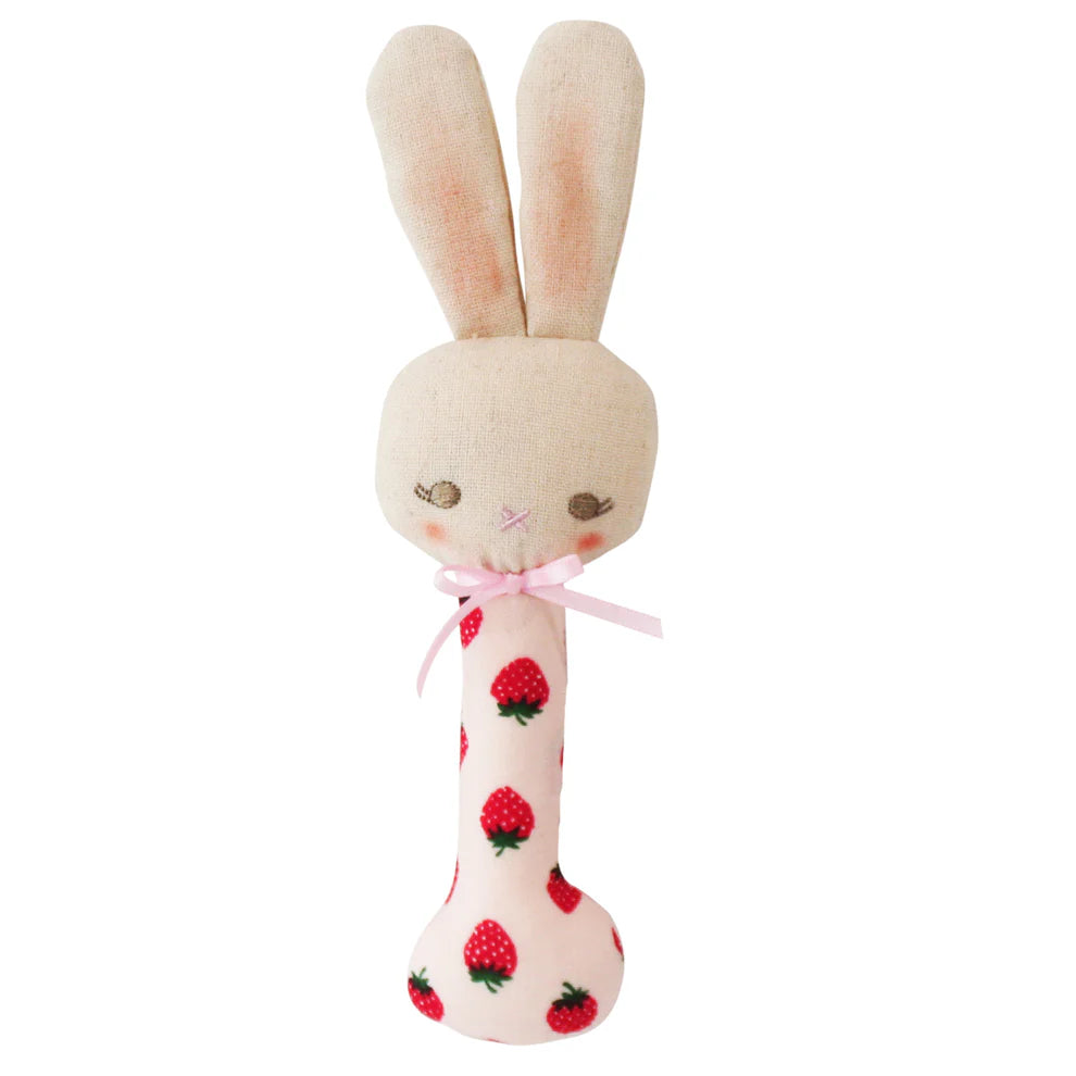 Plush toy rabbit with strawberry pattern on a white background
